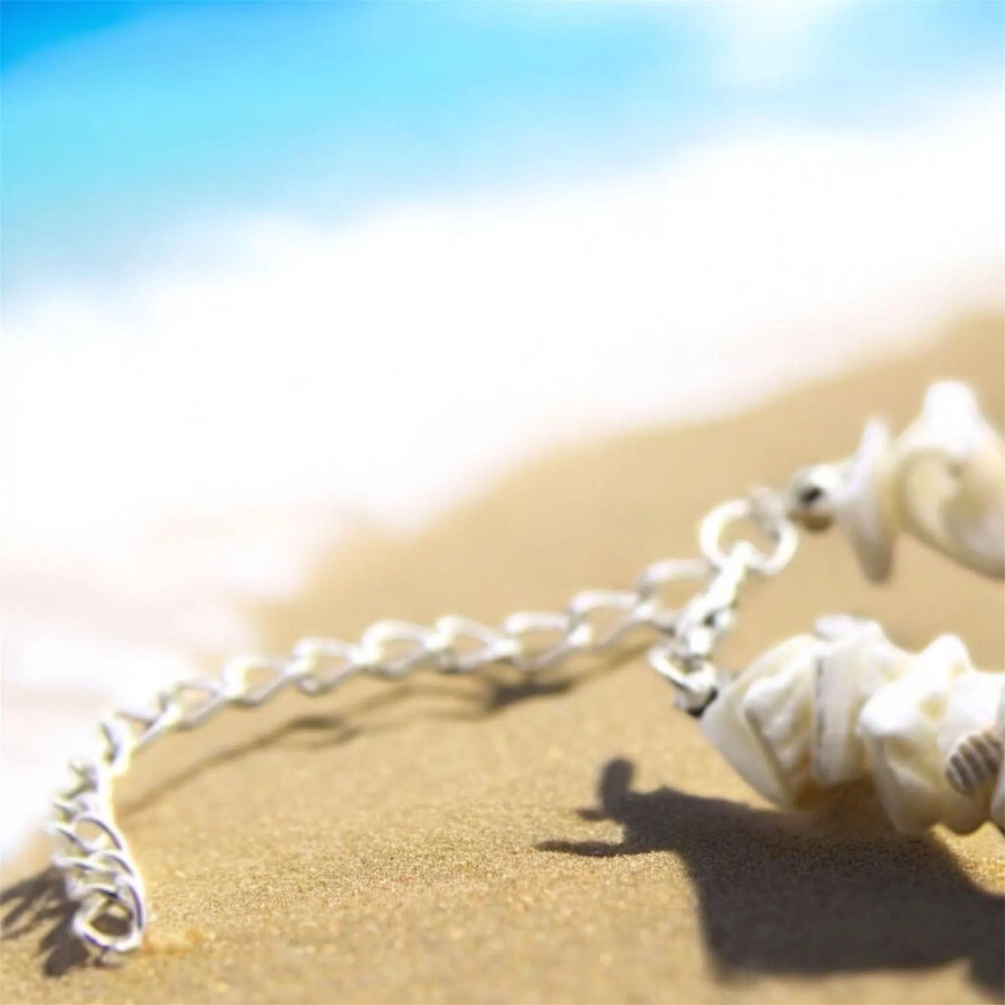 Silver catch of a shell necklace.