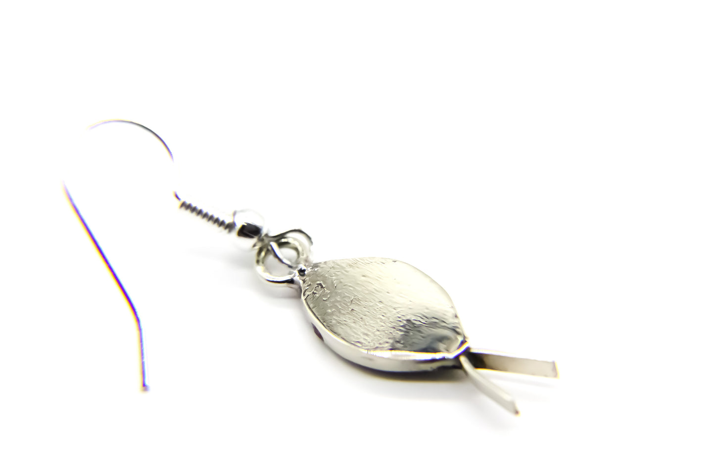 Rear of silver drop earring in the shape of a fish