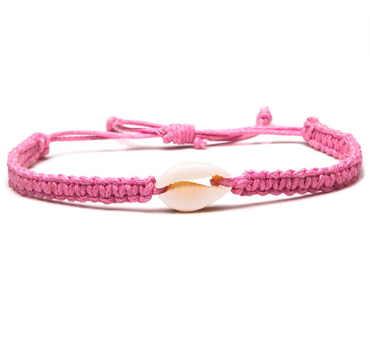 Braided pink bracelet with cowrie shell
