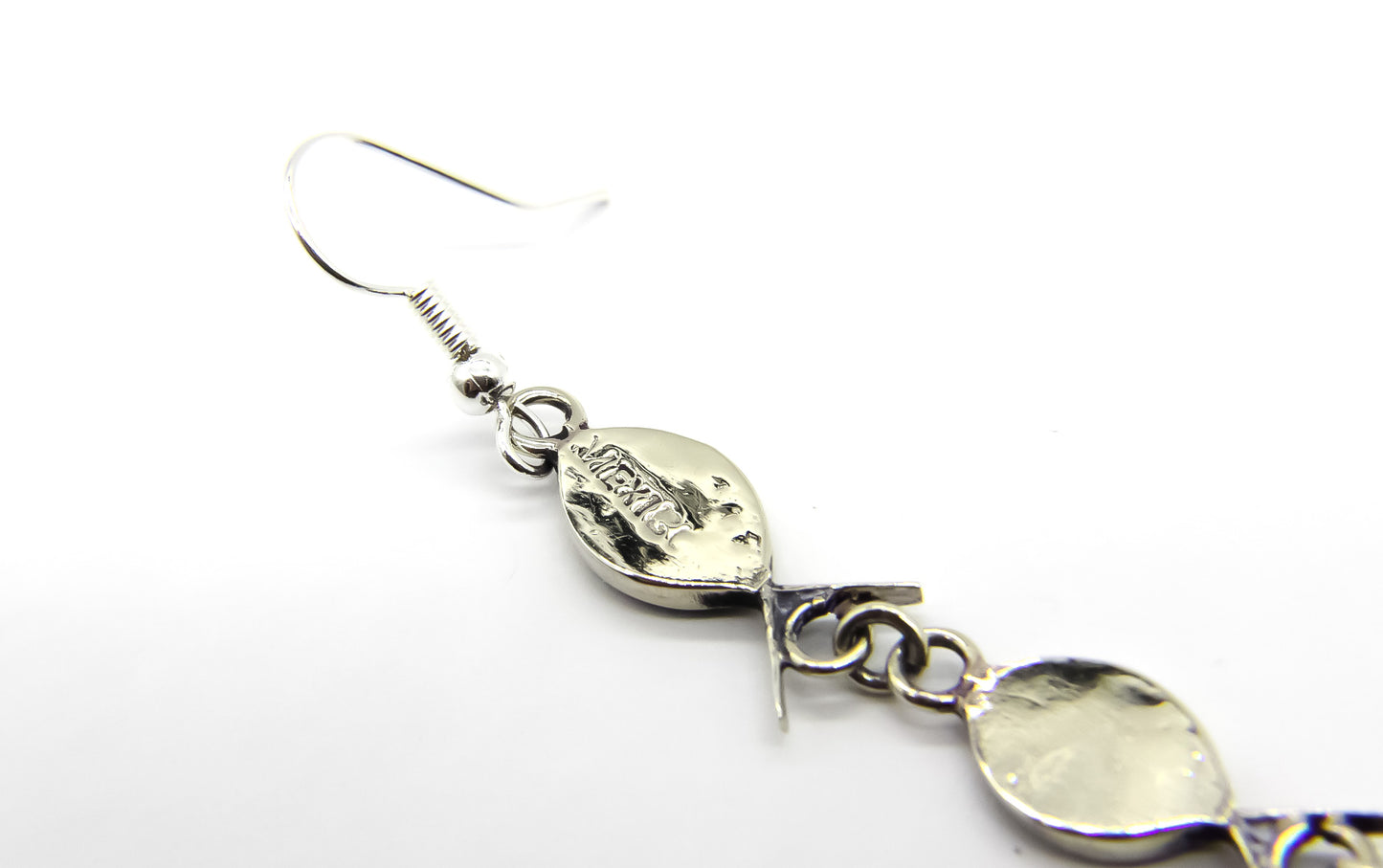 Back of silver earring showing Mexican hallmark