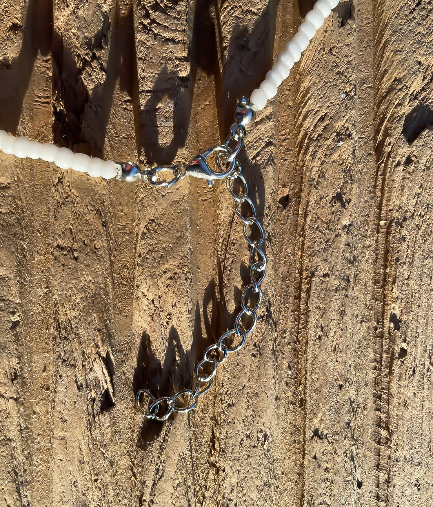 Silver catch on white seed bead choker