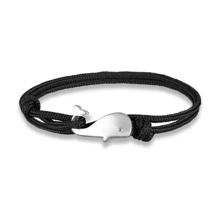 Black cord wrap bracelet with silver whale pendant.