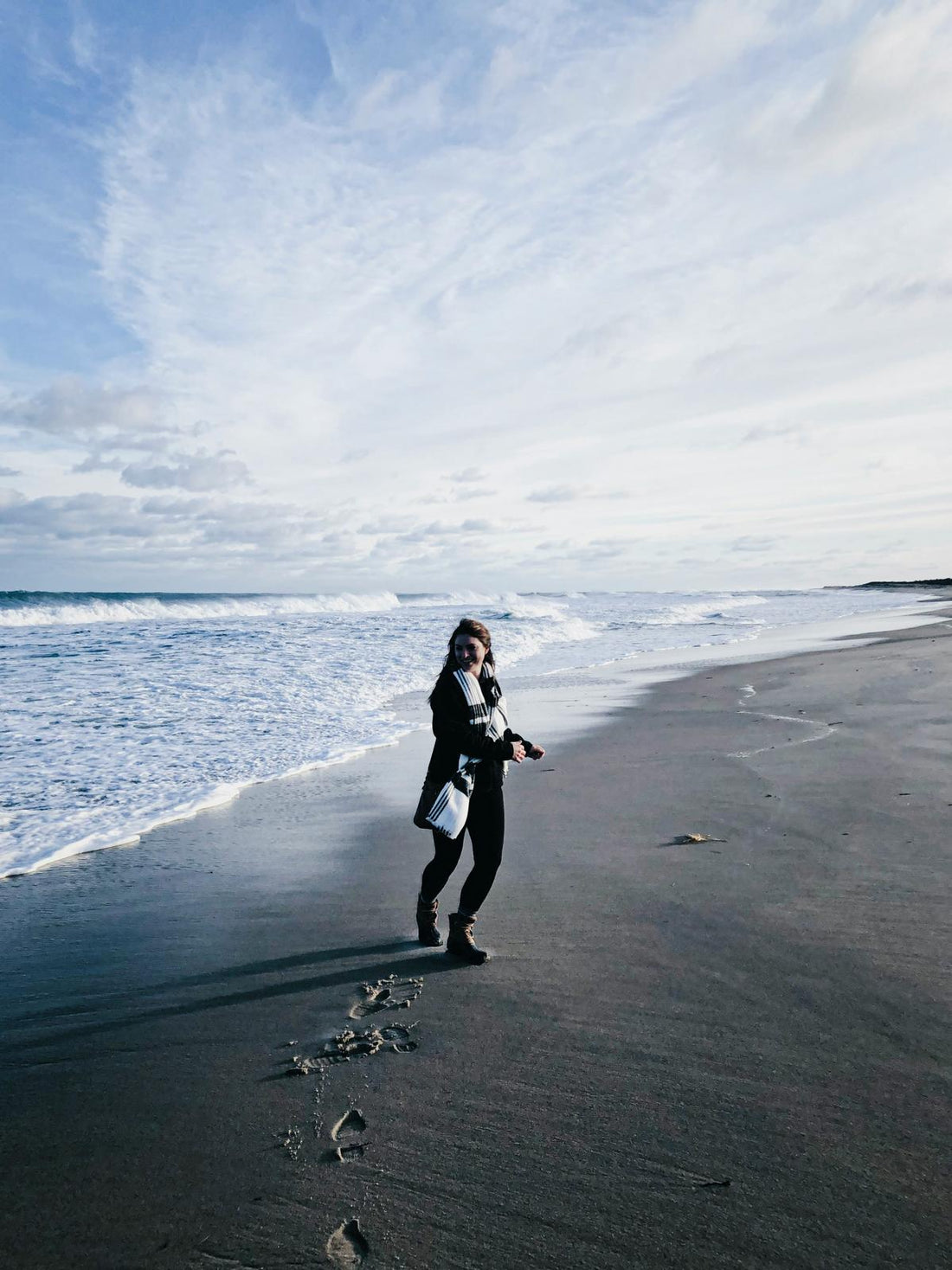 Woman on a beach in winter. 