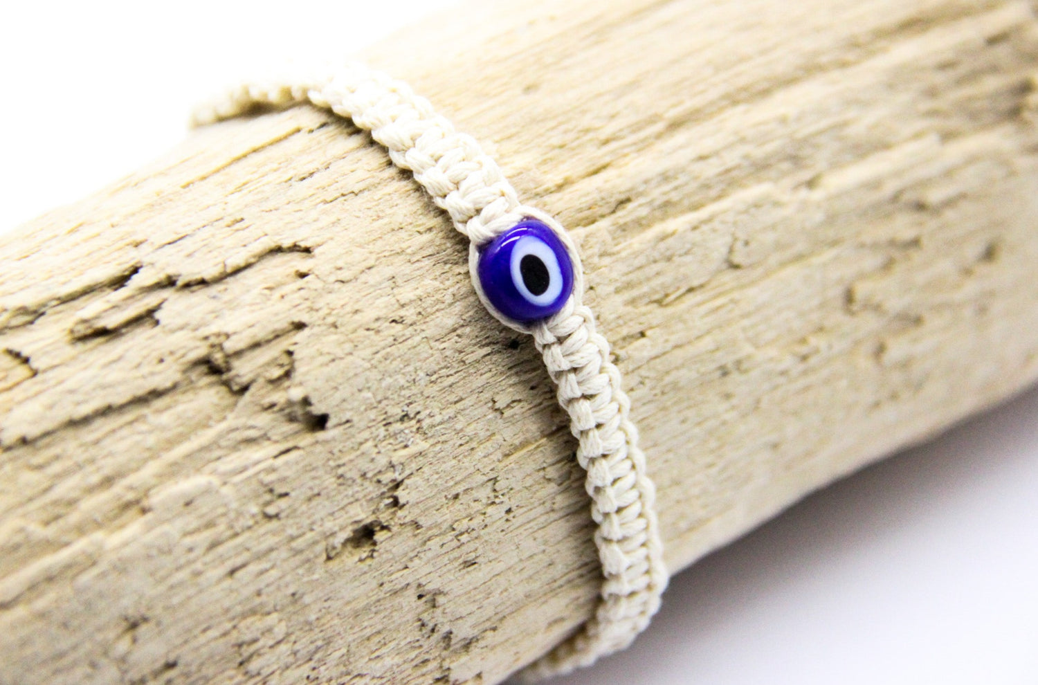 cream woven bracelet with evil eye bead - beach jewellery