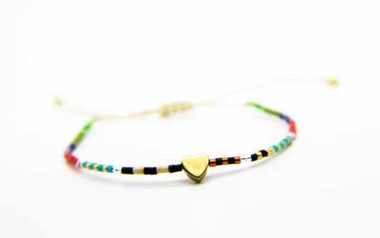 multicoloured bracelet with gold heart pendant