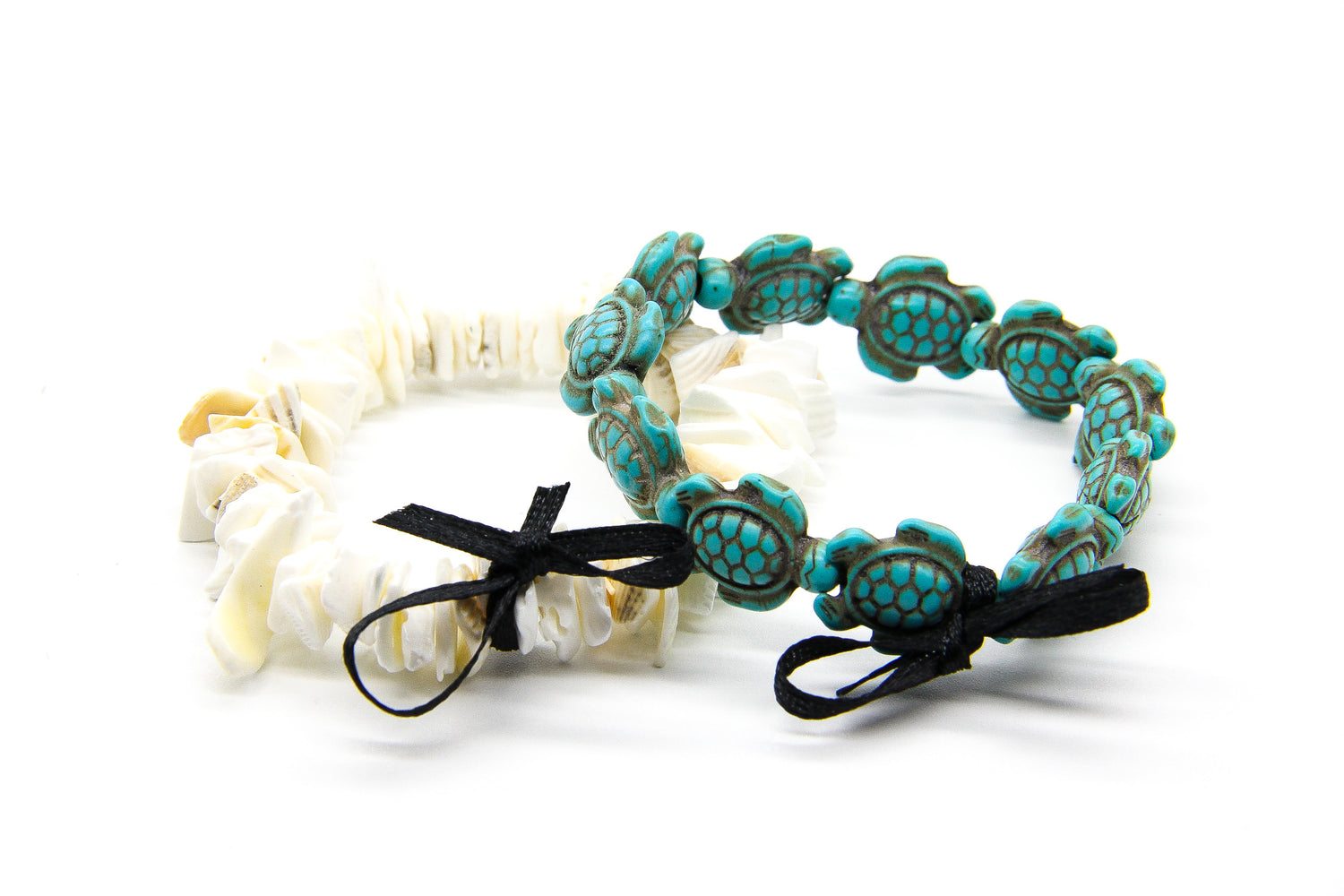 Pair of beach-style bracelets 1 made from seashell chips, the other made from turquoise sea turtles 
