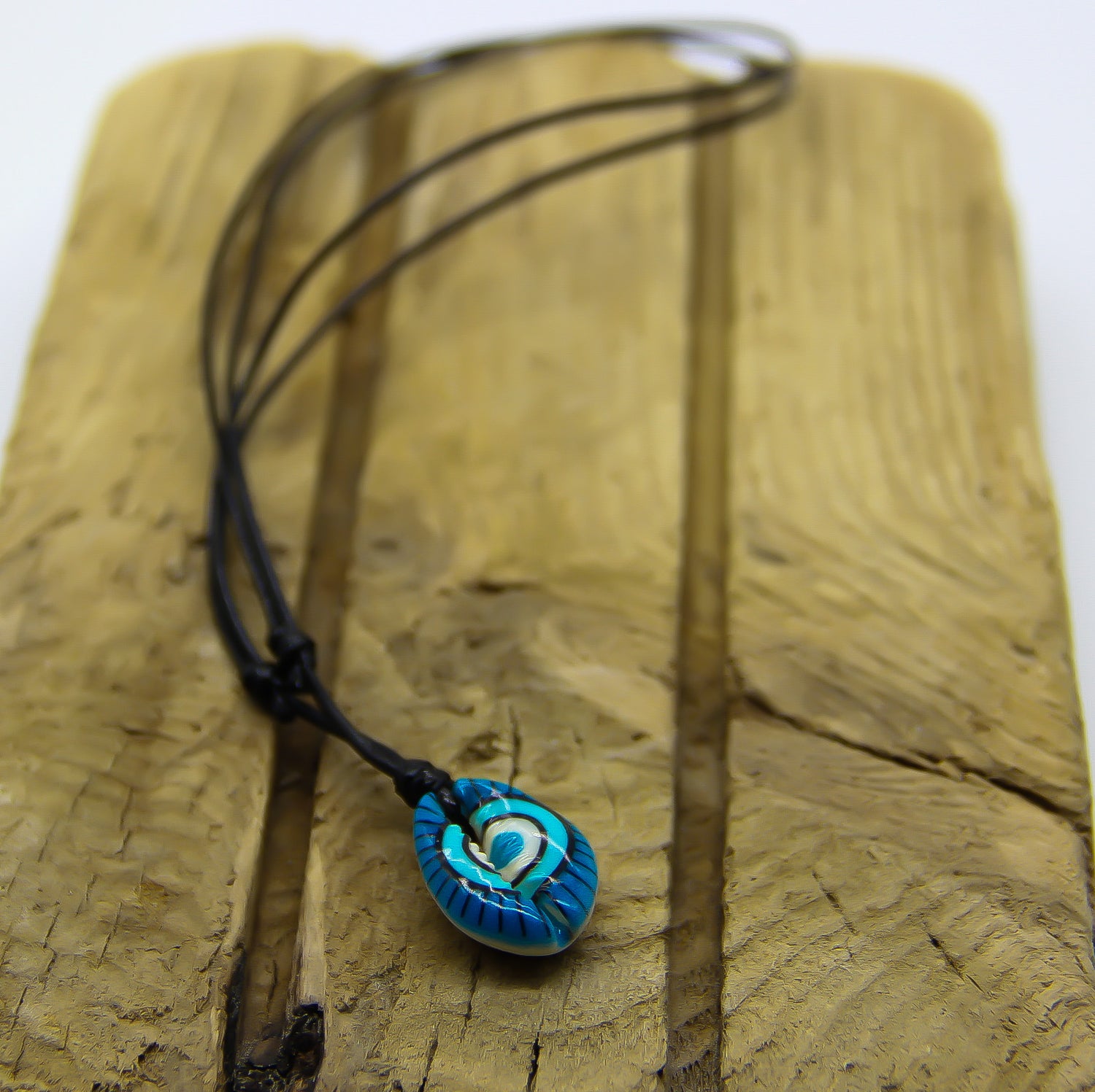 Black necklace with painted cowrie shell choker