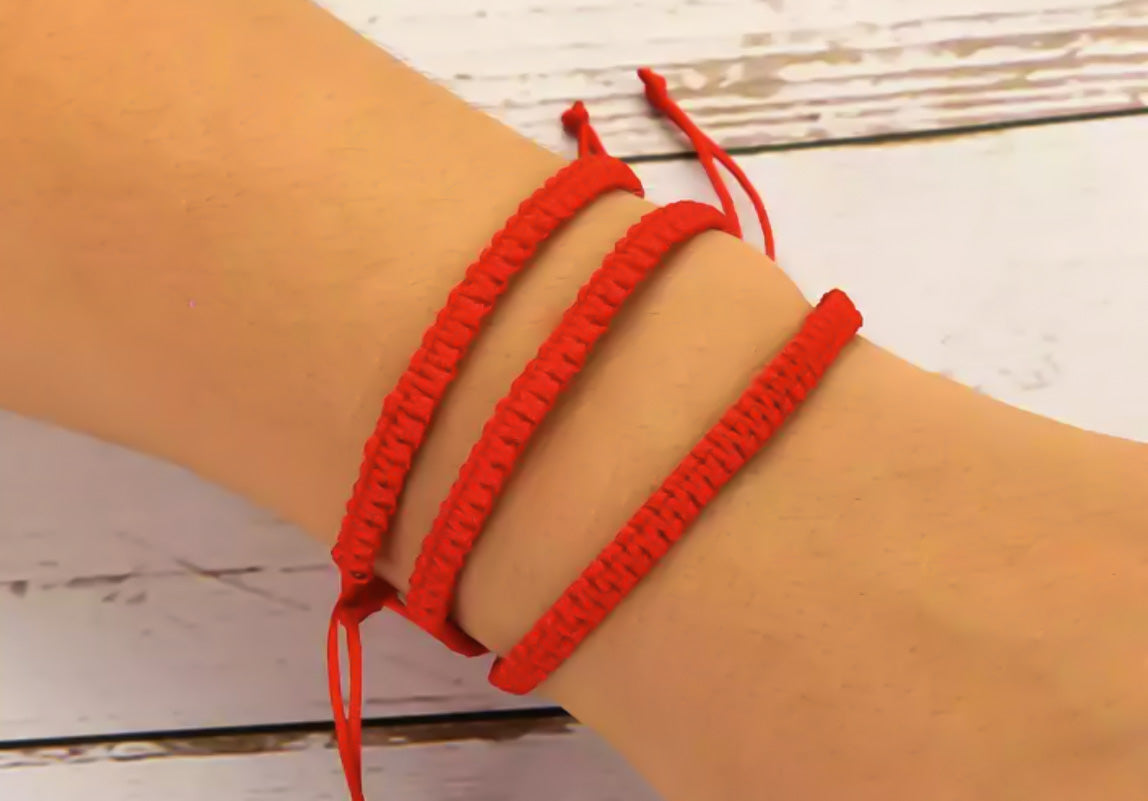 Model wearing red friendship bracelets - Ben's Beach