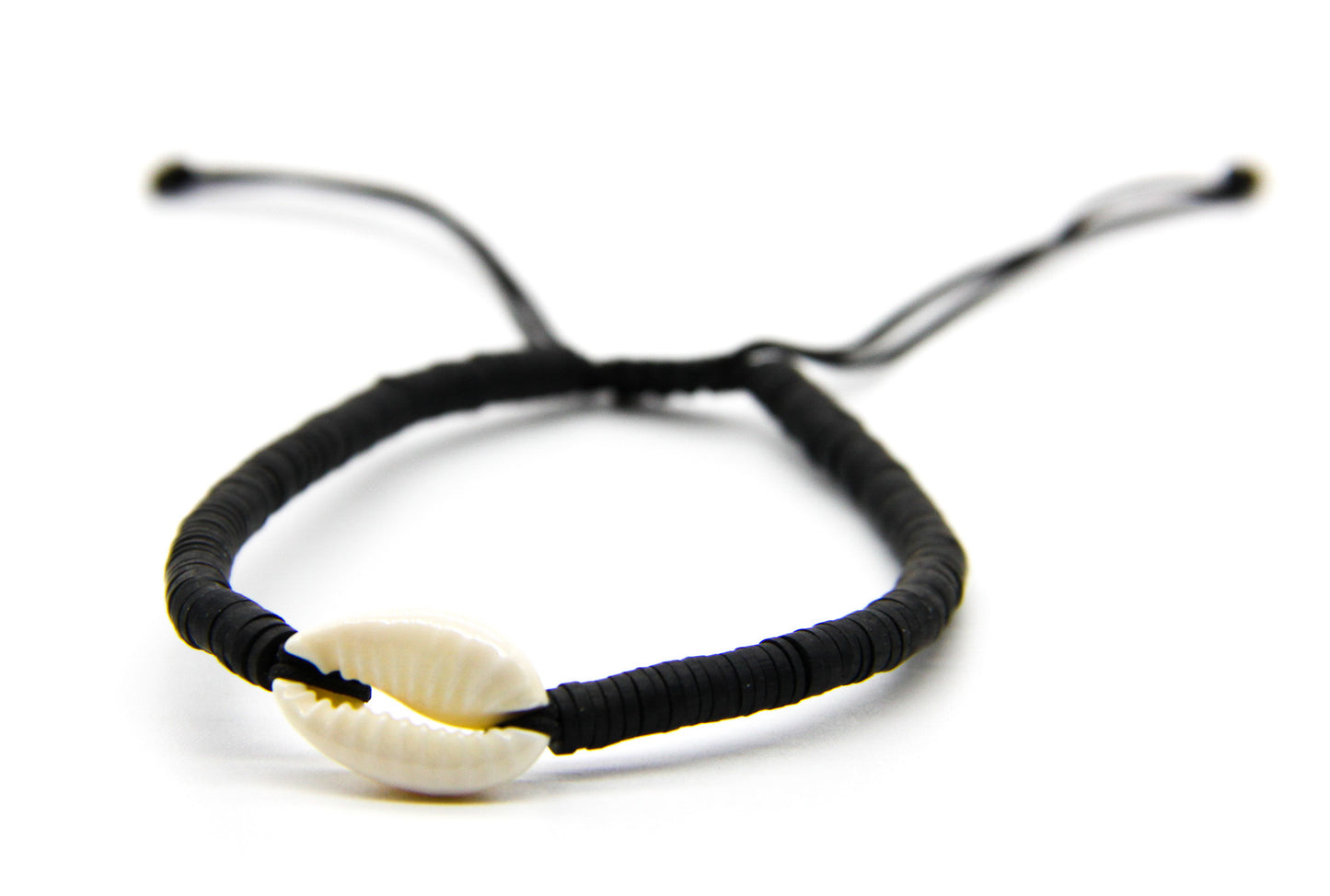 Black braided bracelet with cream seashell pendant