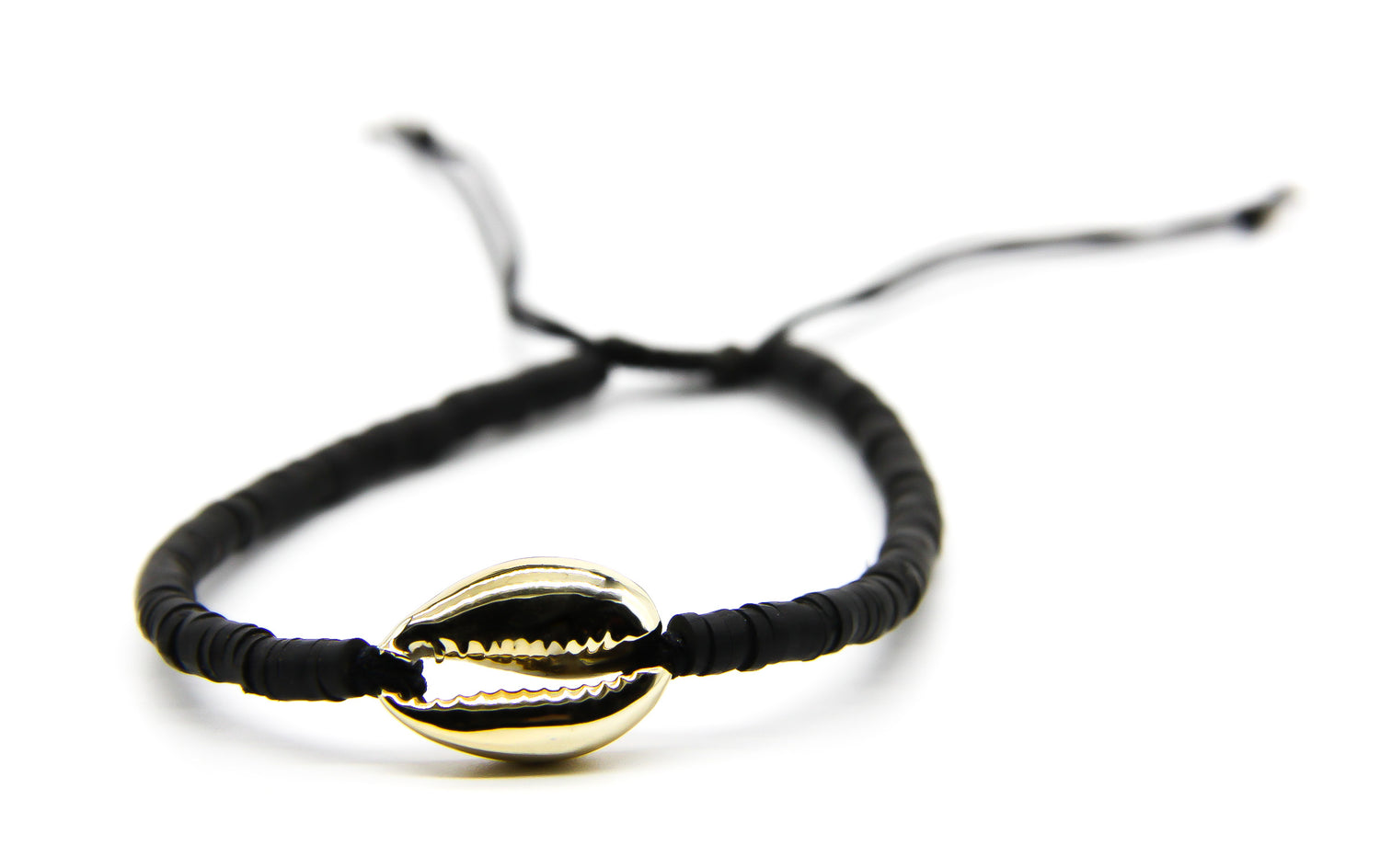 Black braided beach style bracelet with gold cowrie shell pendant