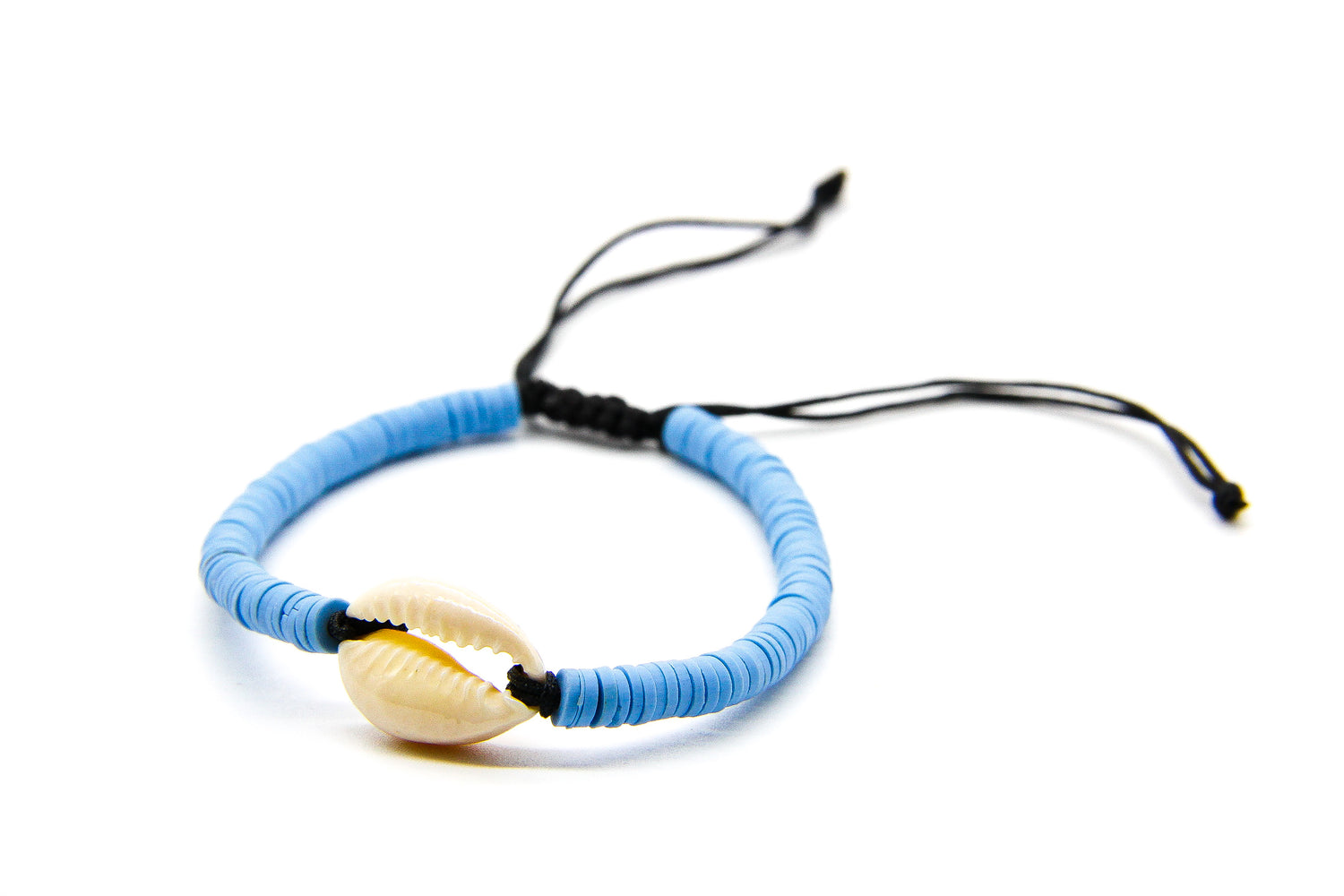 blue braided bracelet with cream seashell pendant