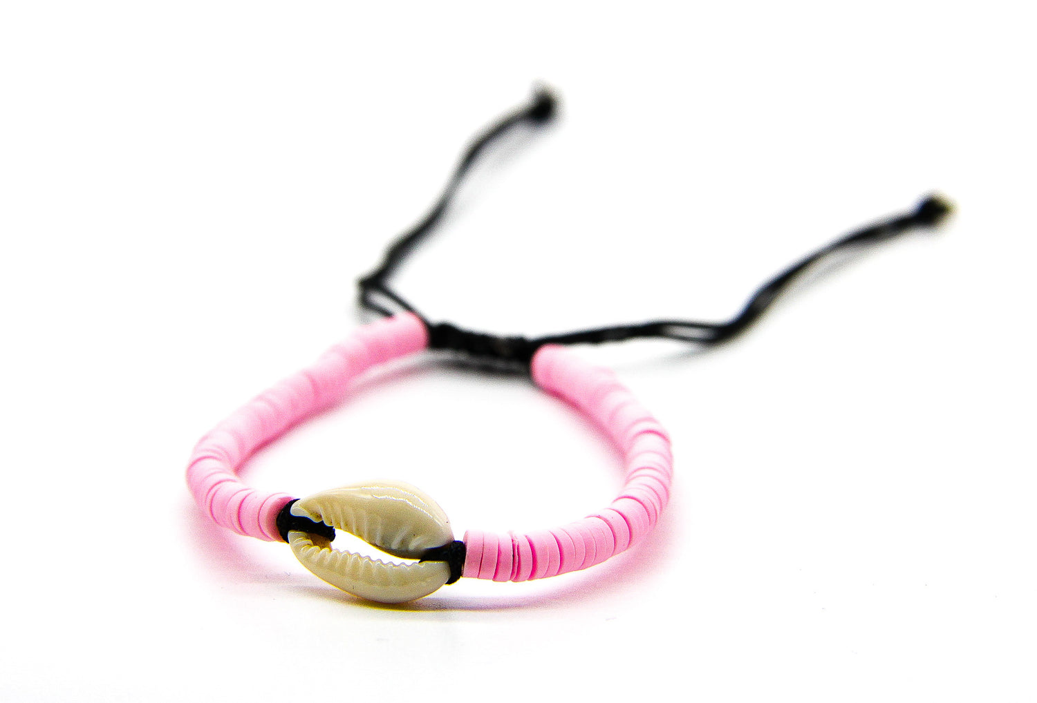 Pink braided bracelet with cream seashell pendant