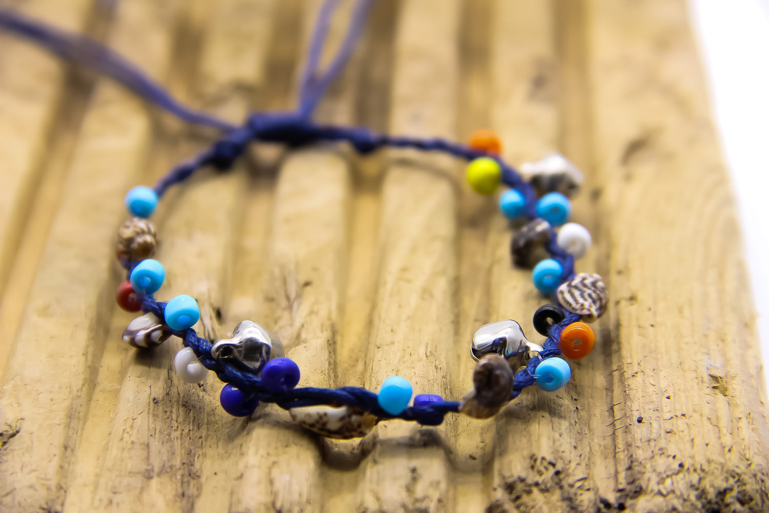 navy anklet with tiny silver bells, shells and colourful beads