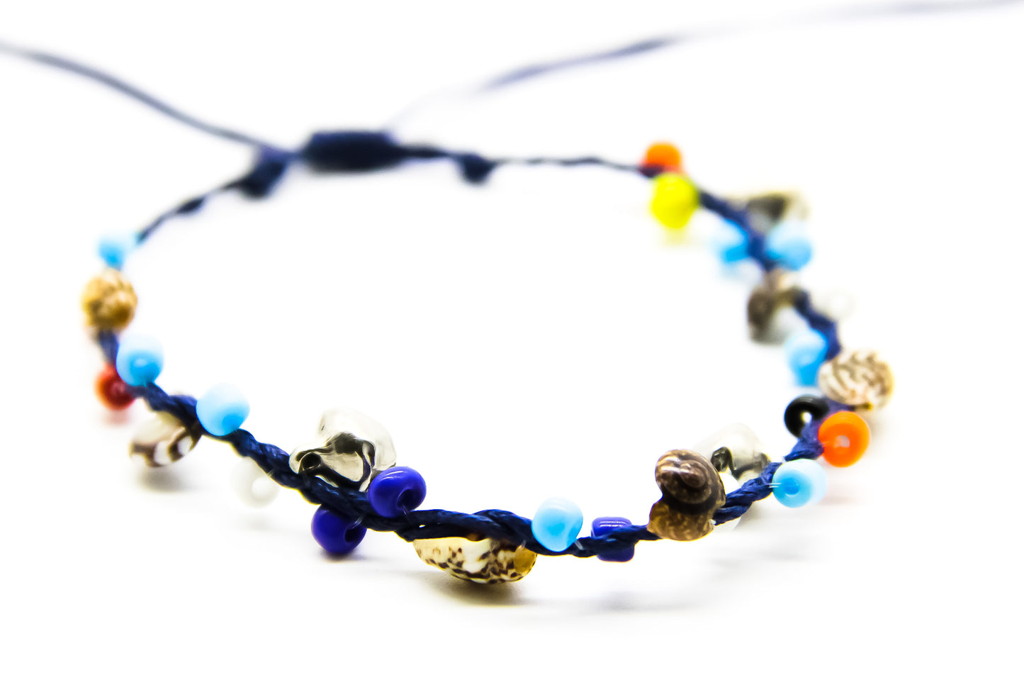 navy blue beach anklet with colourful beads, shells and silver bells 