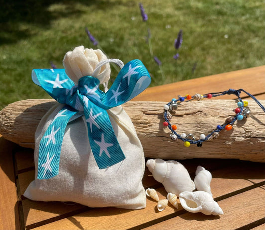 filled party bag with beach jewellery