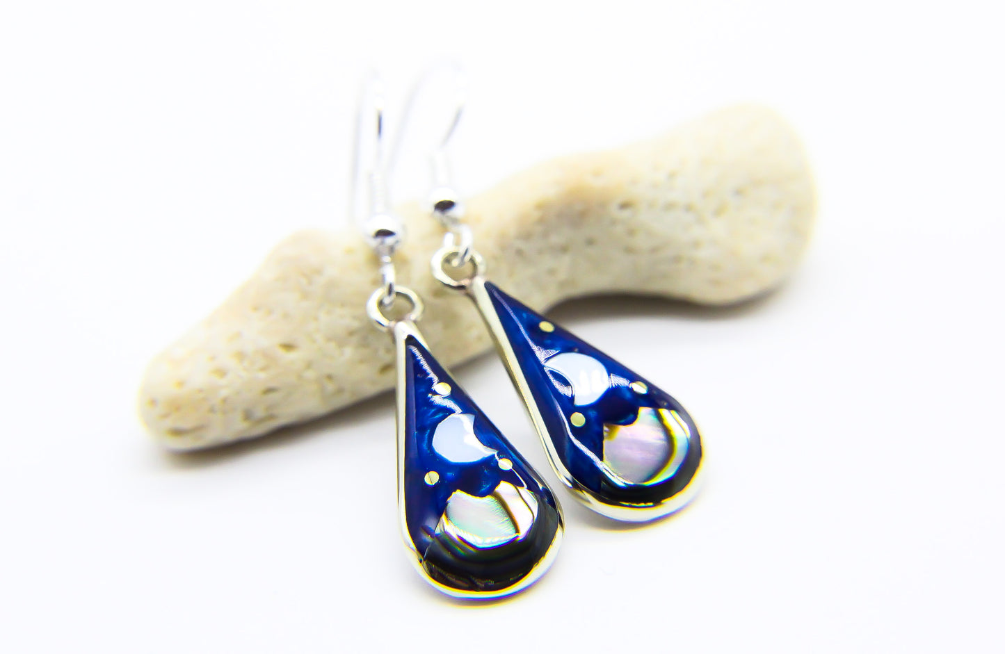 Blue and silver tear drop earrings with moon and stars inlaid design 
