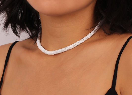 Model wearing puka shell necklace 