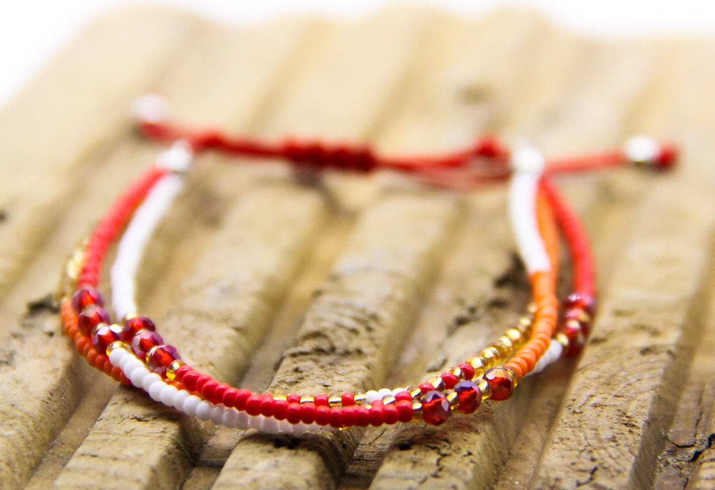 Seed Bead Bracelet in red, white, orange and gold