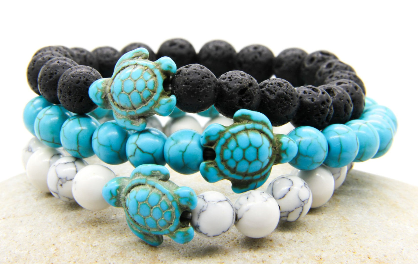 Beaded bracelets in black, white and turquoise with sea turtle pendants 