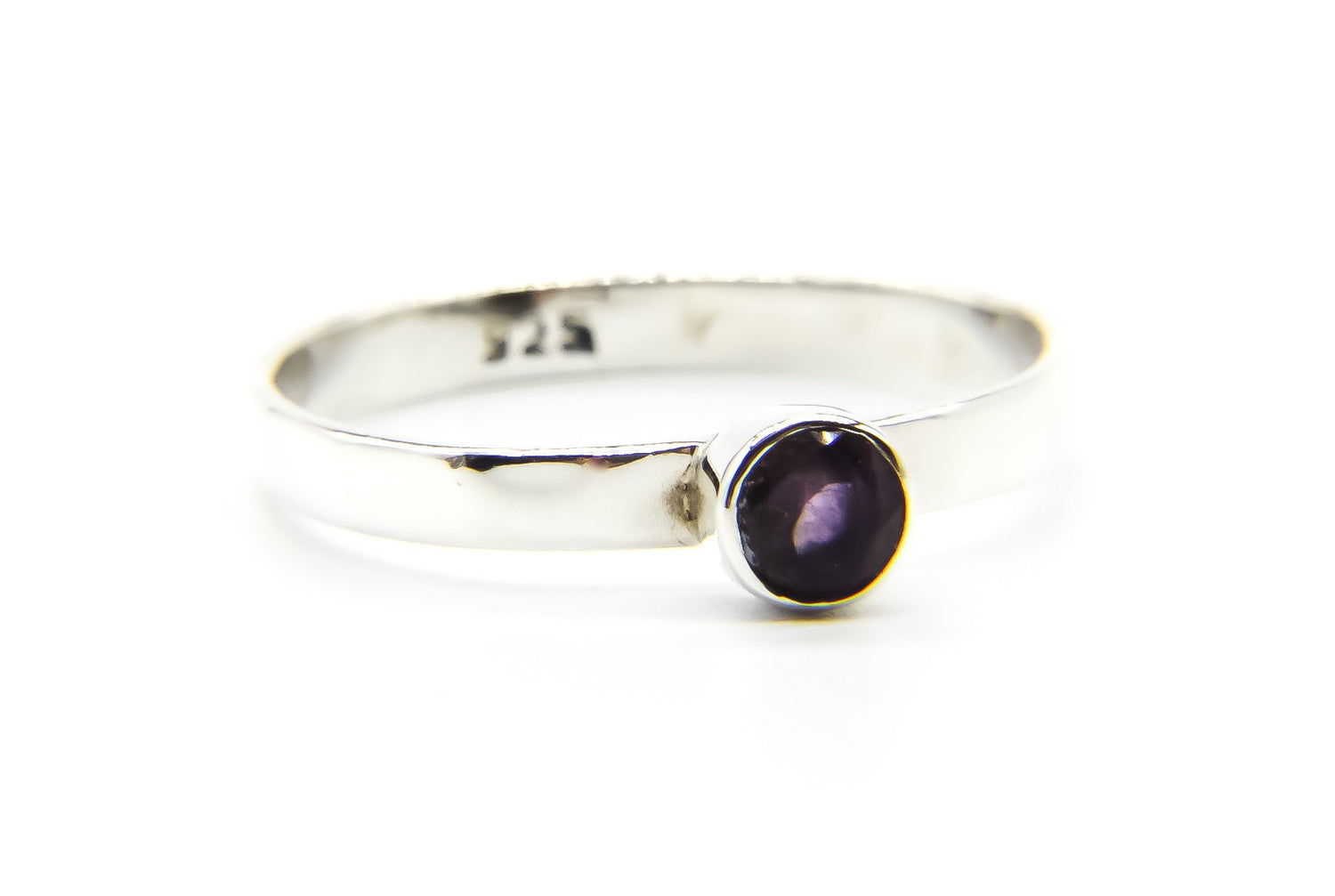 Close-up of Silver Ring with 925 stamp showing. Ring has purple amethyst stone