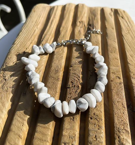 white stone chips bracelet on a piece of slatted driftwood