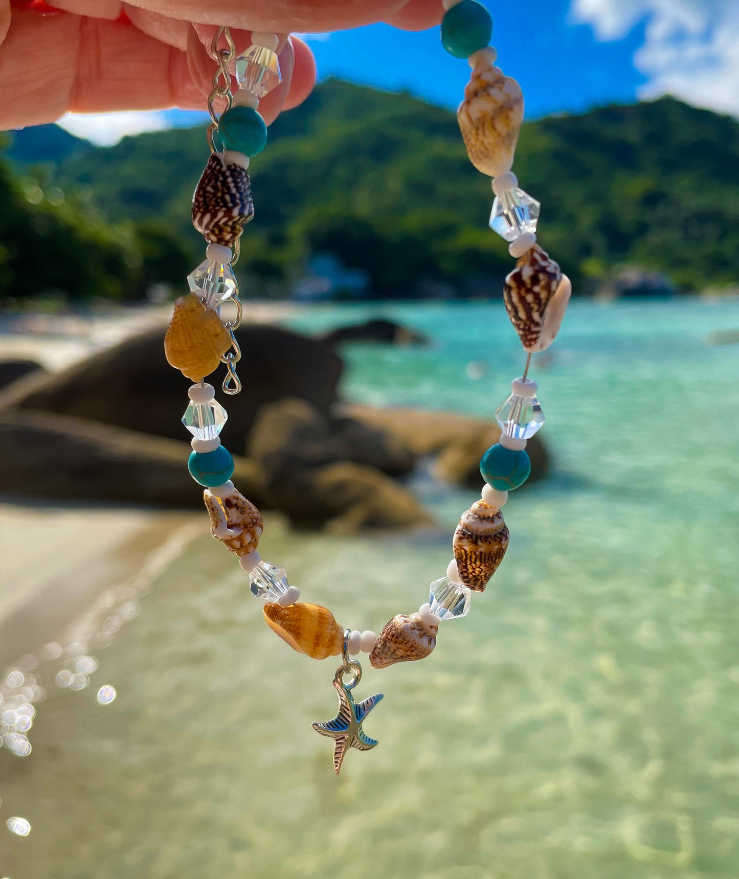 Beach Anklet with sea and sand behind - Ben's Beach Jewellery 
