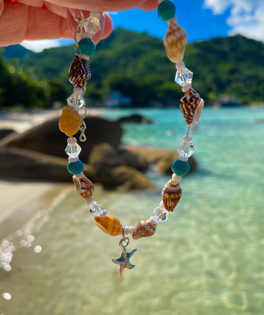 Beach Anklet with sea and sand behind - Ben's Beach Jewellery 