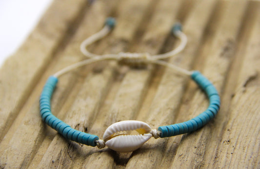 Beach Bracelet with blue disc beads and cowrie shell