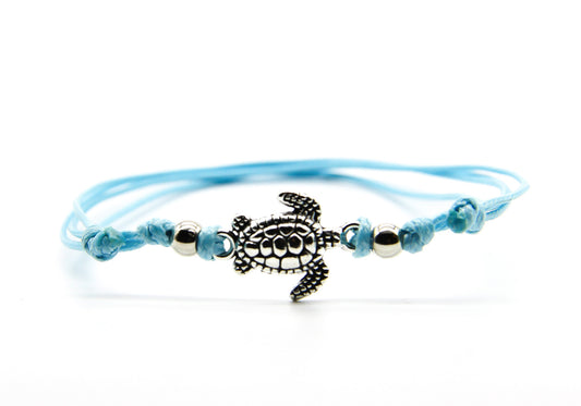 Pale blue string anklet with silver sea turtle pendant 