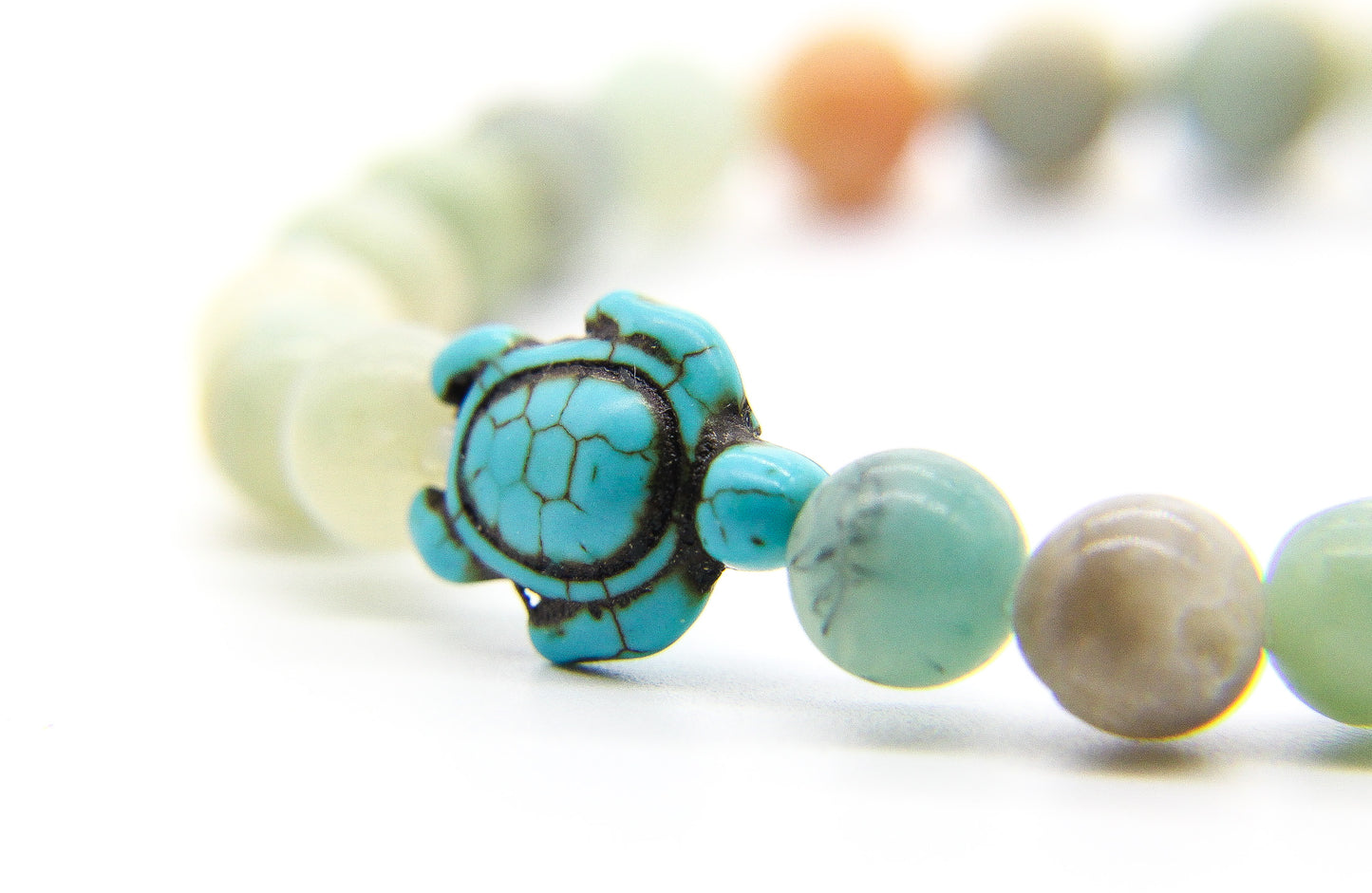 bracelet of semi-precious beads with turquoise turtle pendant