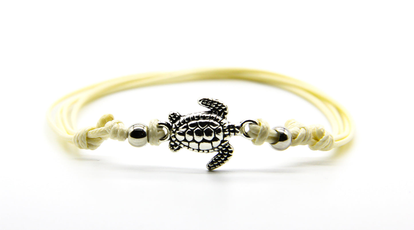 Cream string anklet with silver sea turtle pendant and beads