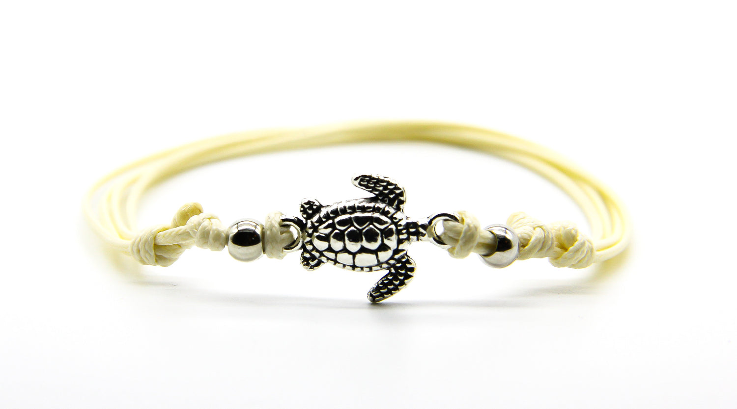 Cream string anklet with silver sea turtle pendant and beads