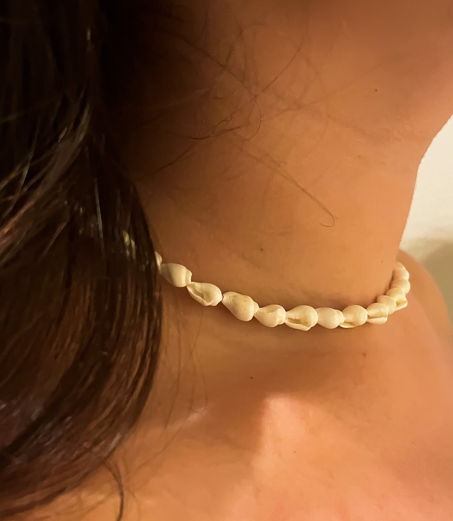 Model wearing seashell necklace
