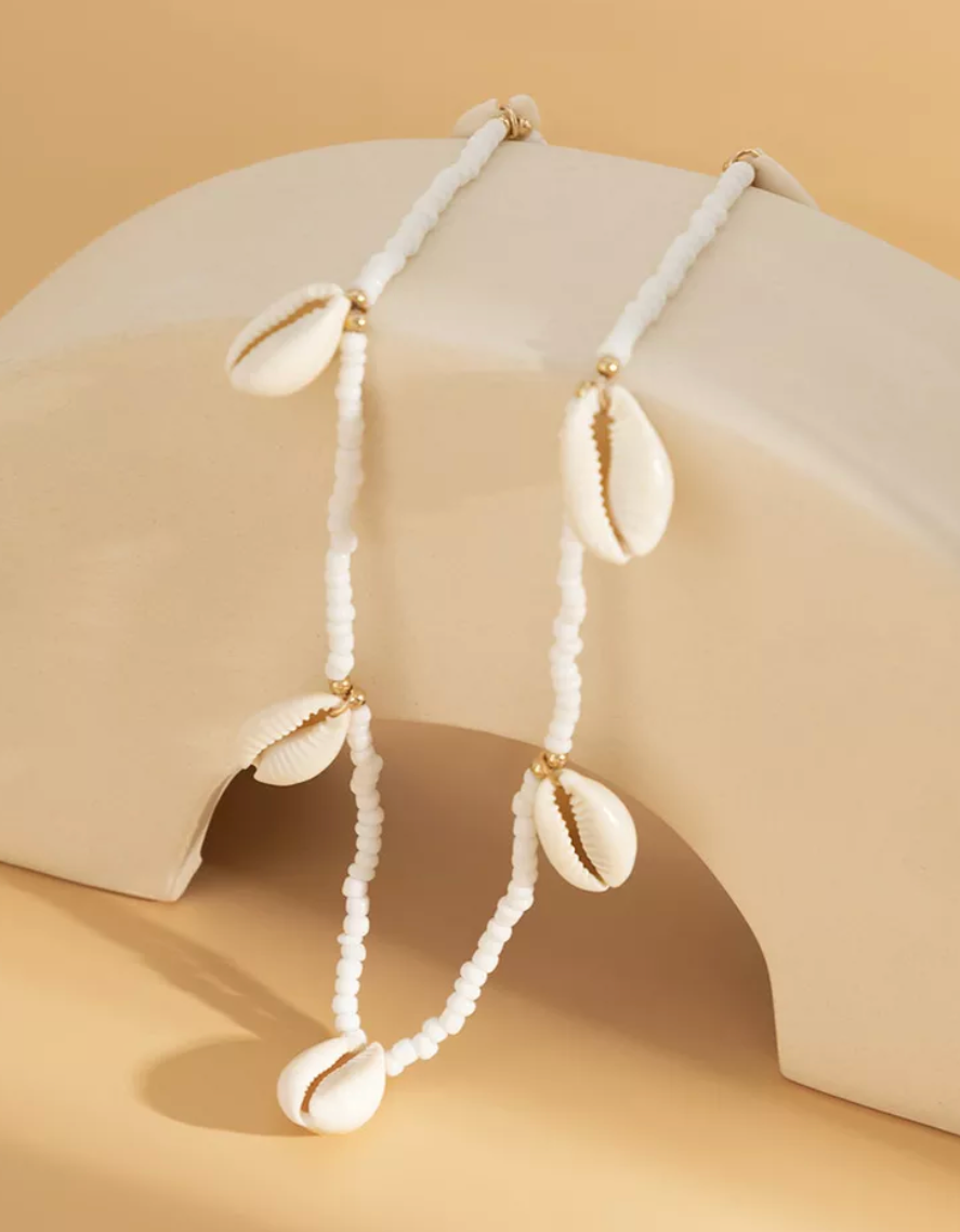 White beaded belly chain with cowrie shells 