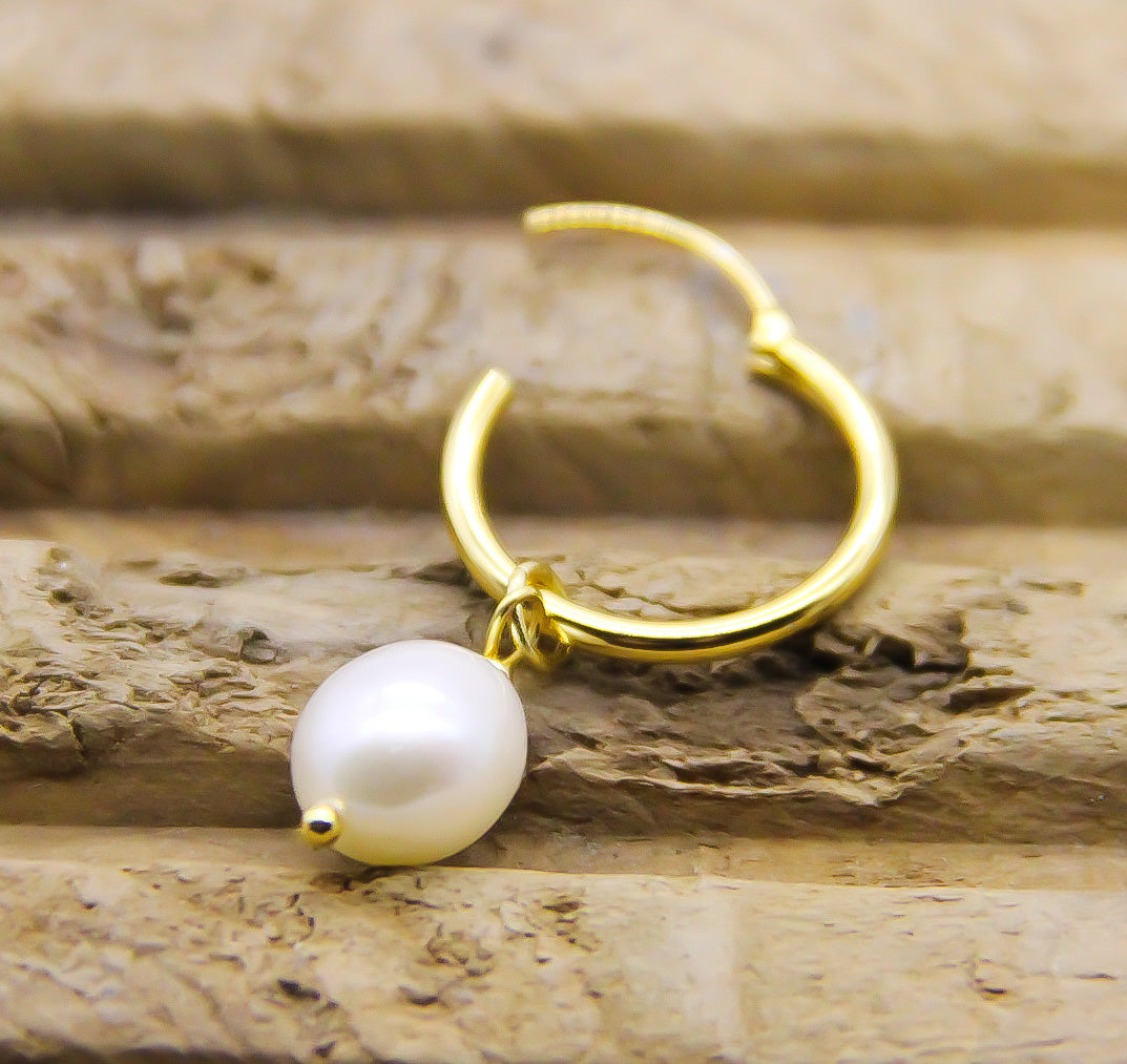 showing opening on gold hoop earring with pearls